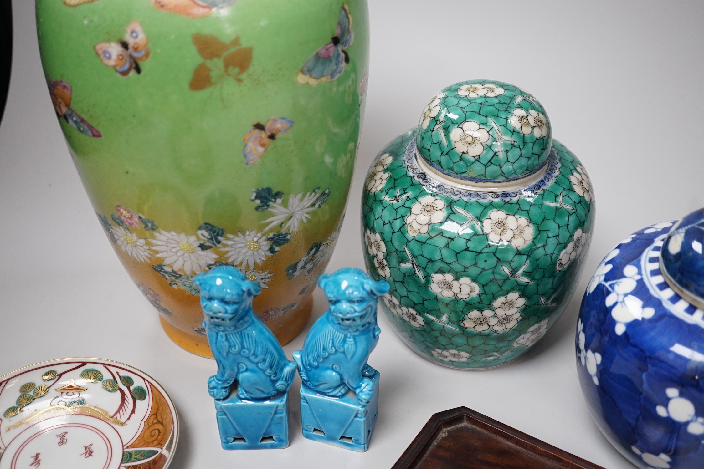 Two Chinese ginger jars, a pair of turquoise lion dogs, a Japanese vase and two similar saucers. Tallest 30cm